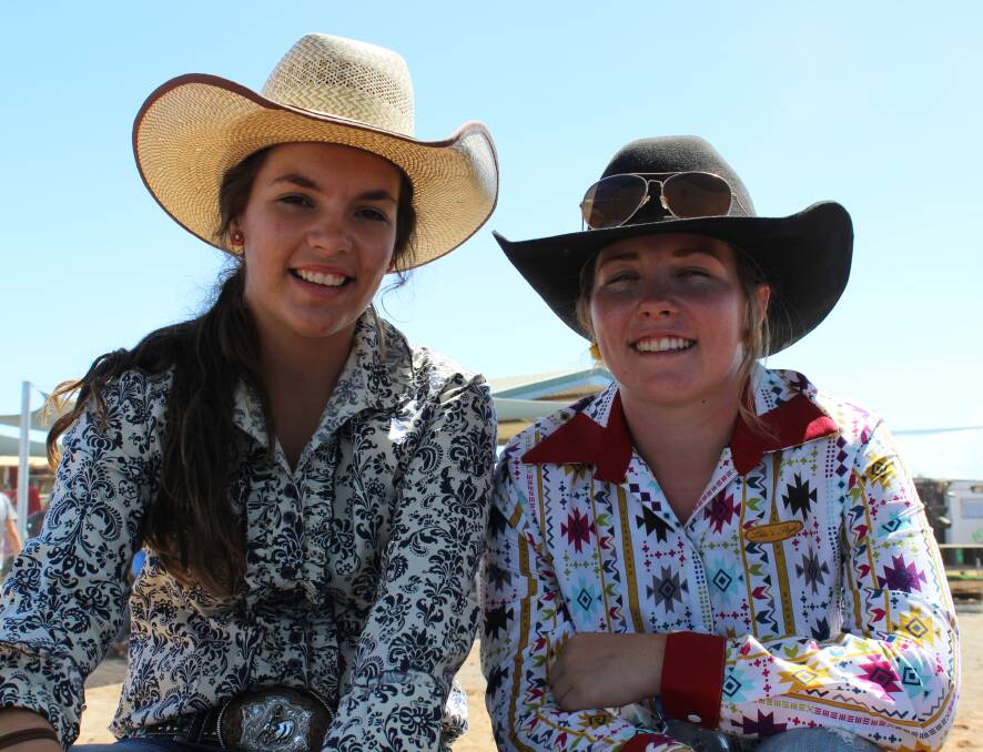 Emmy Gallaghan and Kelly-Jo Litchfield watching the Maiden 4 Maiden campdraft at Yelvertoft Station.