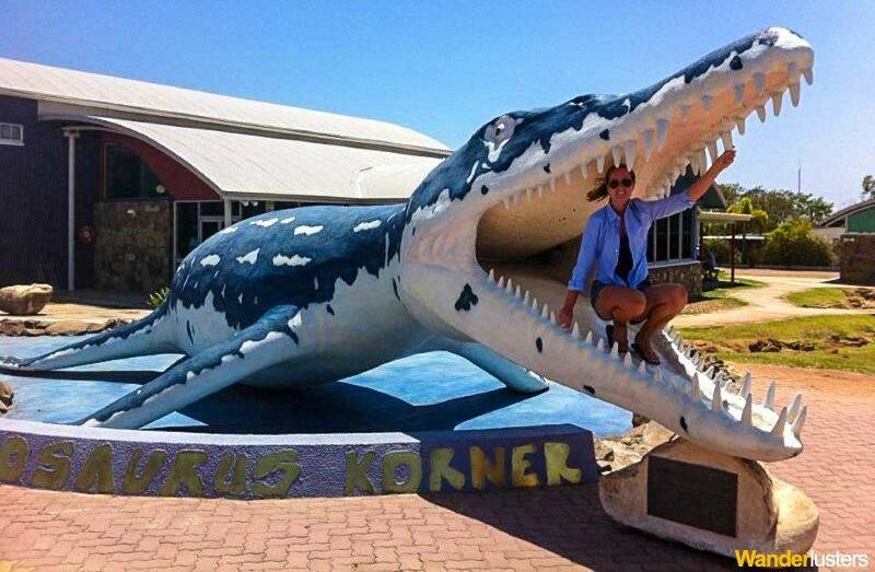 Tourists get a photo out the front of Kronosaurus Korner. Photo sourced.