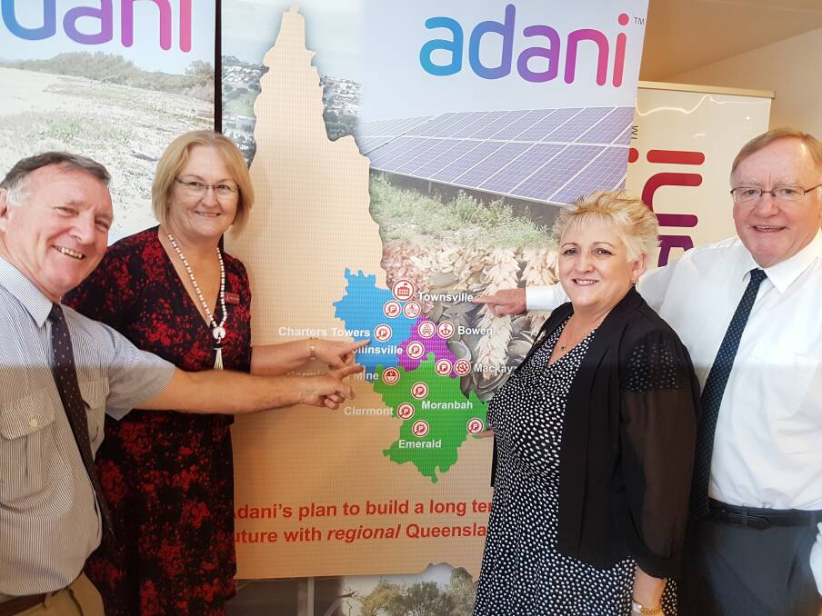 Charters Towers Mayor Liz Schmidt shows her delight with the Adani announcement with, Bruce Hedditch, Bowen Chamber of Commerce; Michelle Landry, Member for Capricornia and Senator Ian Macdonald.