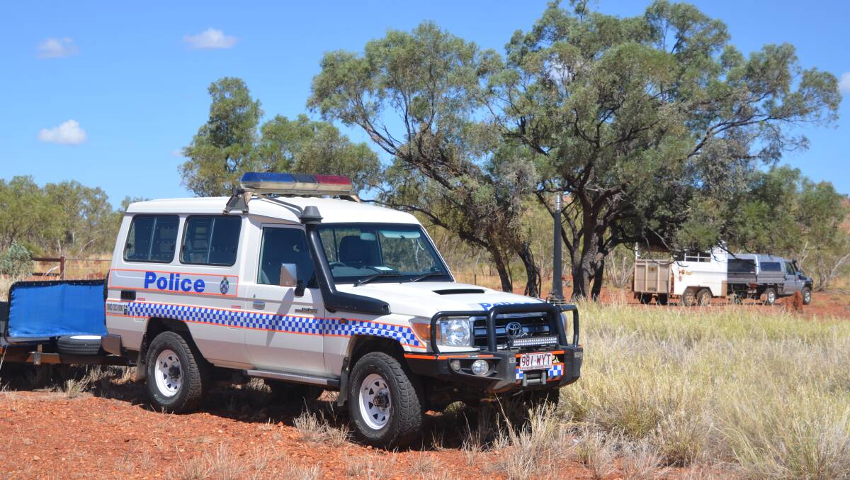 Police search a property near the Barkly Hwy east of Mount Isa for the missing man.
