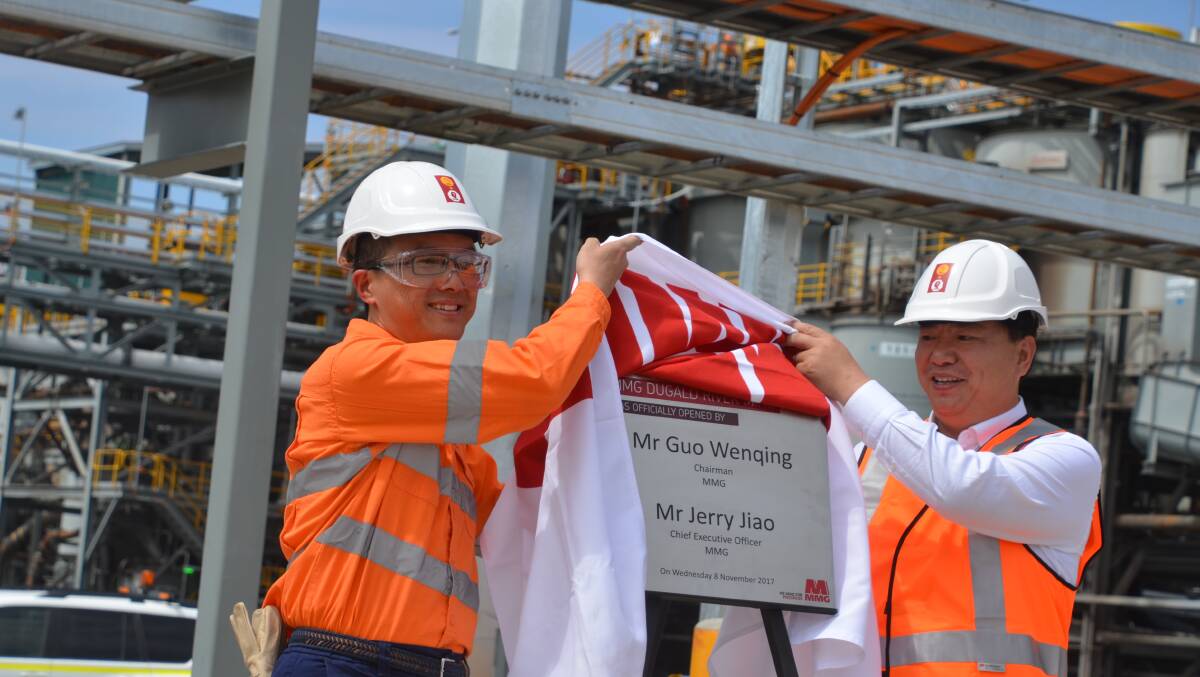 UNVEILING: MMG's CEO Jerry Jiao and chair Guo Wenqing officially open the mine. Photo: Derek Barry