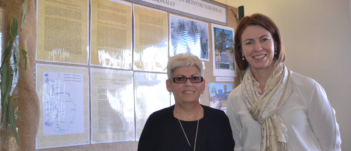 FETED: Debbie Godier and Mayor Belinda Murphy with the display on the life of Duncan McIntyre. Photo: Derek Barry