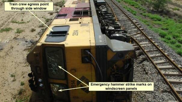 The train crew escaped from the locomotive through climbing up and out the sliding side window. Source: Queensland Police Service