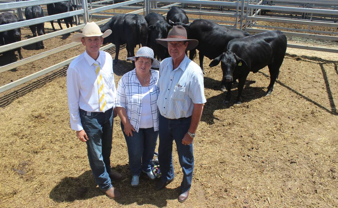 Top dollar: Gary Wendt, Ray White Rural Gracemere, is pictured with top-price buyers Ross and Lorraine Prange, Mt Larcom, and the pen of five heifers, which they bought for $2600 a head.