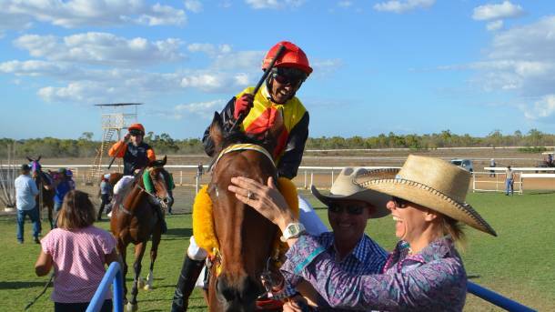 Jubilant trio: Robert and Sally Kirkwood were over the moon after Cracow and his thrilled jockey Jeffrey Felix won the Charters Towers Amateur Cup.