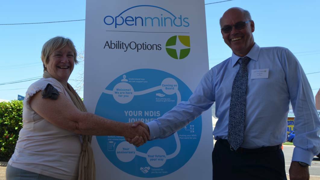 CEO of Open Minds Australia, Marie Fox and CEO of Ability Options, Fred Van Steel celebrate the companies partnership.