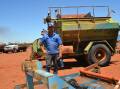 Brendan McConkey, Geraldton, inspects a 3.6m PTO-drive gang mower which sold for $3000.
