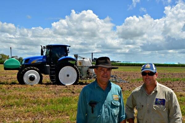 Bob and Christian Lago with the New Holland T6030 High Rise Agricultural Tractor.