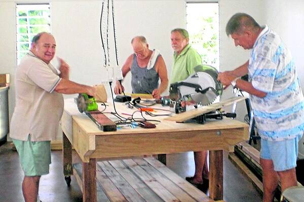 Denis Ernst, Bill Kaukiainen, Mal Malyon and Peter Little busy in The Tully Men's Shed.