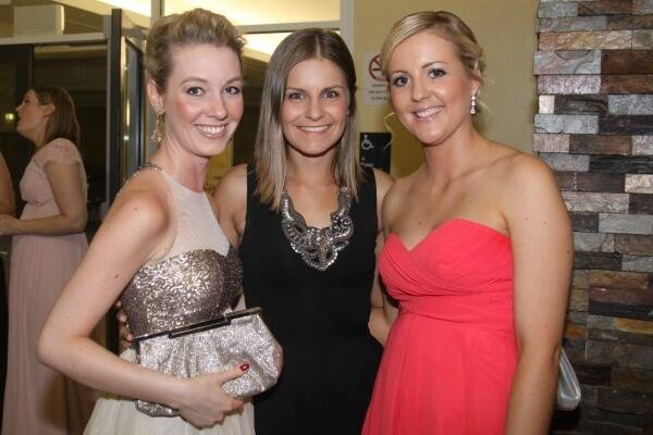 Cloncurry belles Danielle Retsener, Thea Dasios, and Bec Dreyer at the Droughtbuster Ball.