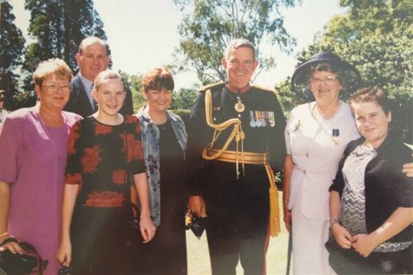 In 2002, Rita was awarded an Order of Australia Medal for “service to the community, particularly through palliative care support groups”.  Here, she is pictured with the Governor of Queensland at the time, Major General Peter Arnison, her son John, daughter-in-law Gayle, daughter Marion, and grandchildren Megan and Danielle.