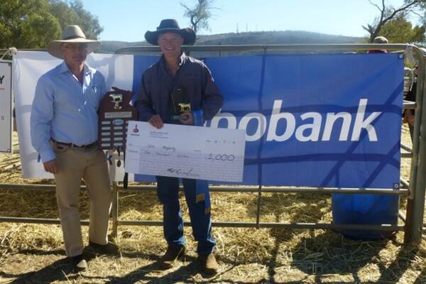 Barry Gerschwitz, branch manager, Rabobank, Darwin congratulates Josh Fogarty, Lucky Creek Station, Alice Springs on taking out this years Rabobank Encouragement Award at Alice Springs show. 