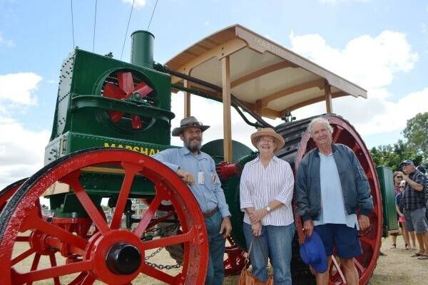 Burdekin Machinery Preservationists Club member John Hanson, Lexie Parisotto and John Parchert take in the majesty of this Marshall Colonial Class C two-cylinder single-speed model oil tractor which is the only functioning one of its kind in the world. 