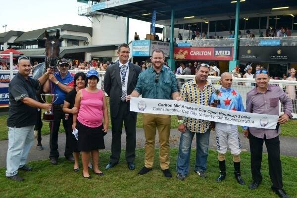 The winning connections of Junee Boy trained by Stephen Potiris (far left) and Carlton Mid Amateur Cup Open Handicap sponsors celebrate.