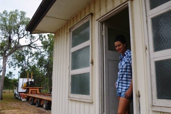 Jo Veneman from Renewable Homes stands in the doorway of the 1960s cottage which was relocated from Fanning River Station, Charters Towers, to a property at Bluewater, Townsville, late last week.