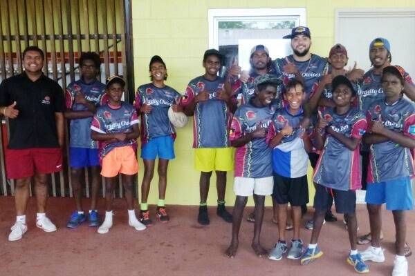 Apunipima Cape York Health Council healthy lifestyle worker Steven Lane (left) and healthy lifestyle officer Zhan Dunn (amongst the students) taught kids about healthy choices as they successfully completed the Deadly Choices Healthy Lifestyles Program.