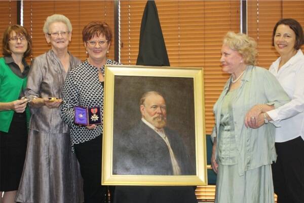 Christina Mackay-Lowes (second from right), the granddaughter of the founder of Mackay, Captain John Mackay, visited with her daughter-in-law Emily Lowes (right) to present a portrait of her grandfather and other memorabilia to council. With the memorabilia are (from left) Vicky Bowden, chair of the Friends of Greenmount Homestead, historian Berenice Wright and Mayor Deirdre Comerford.