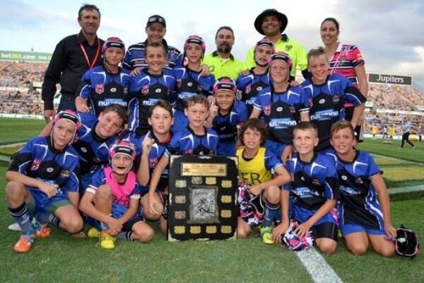 2015 Laurie Spina Shield winners the Western Lions Pride celebrate their victory while carnival namesake and inaugural Cowboy Laurie Spina (back, first from left) was on hand to present the shield to the team. 