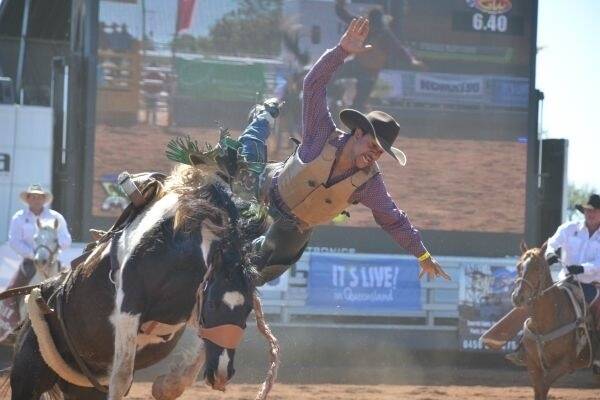 Lane Grayson hits the eject button during the bronc ride.
