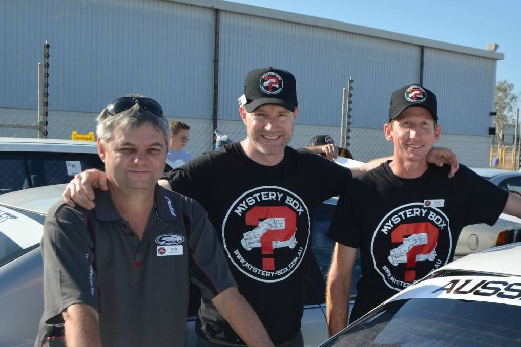 Box Rallies founder James Freeman (middle) with Mystery Box Rally teammates Craig Robinson and Brent Campbell, Townsville, just before departing for the first leg of the five-day trip.