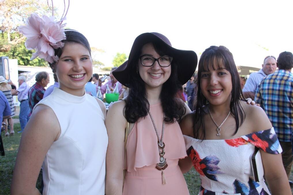 Local ladies: Ingham's Natalie Romano; Sharni Cantatore; and Rachel Cazzulino having a great time at the Ingham Gold Cup Races..