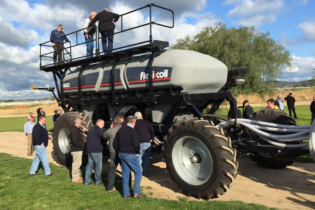 Flexi-Coil dealers eagerly inspect the latest release Series 60 air carts from the seeding segment leader in Wagga last week.