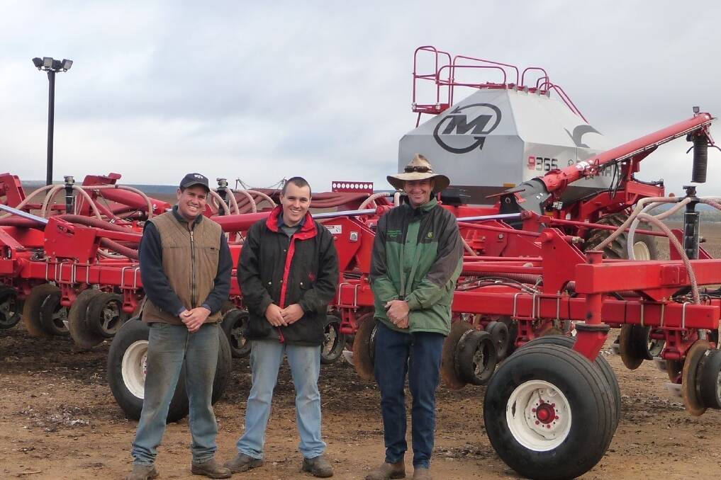 Nick Beer, Brendan Lee and David Brownhill, Merrilong Pastoral Company, with the Morris 9 series seed cart and 18-metre RAZR disc drill.