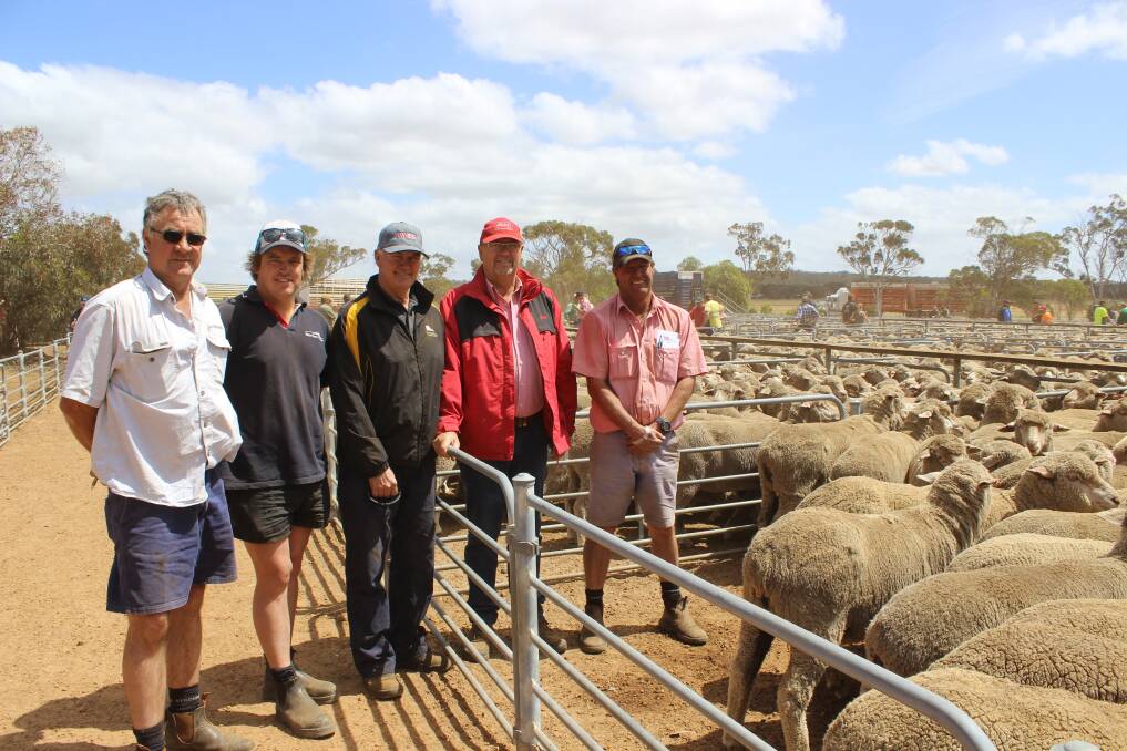 Westcoast Livestock York agent Mark Fairclough (left), paid the top price of $156 on behalf of his client Rodney Haythornthwaite to purchase these 1.5yo ewes with them is vendor Al Whyte, Kondinin, Elders auctioneer Don Morgan and Elders Corrigin agent Tony Douglass.