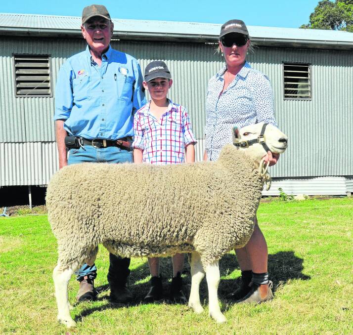 Morton stud’s John Corbin, daughter Emily Davidson, and grandson Jack Davidson with the ram, initially reserved for the multi-vendor Horsham Border Leicester sale, which sold for $3000.