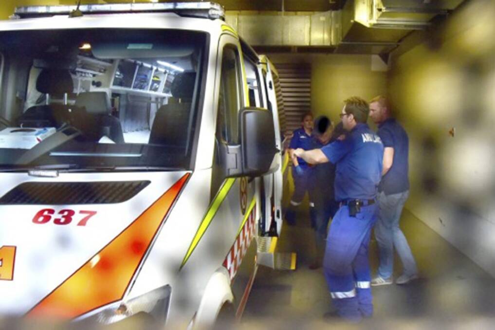Gino Stocco is taken away from Dubbo police station by ambulance. Photo: Brook Kellehear-Smith / Daily Liberal 
