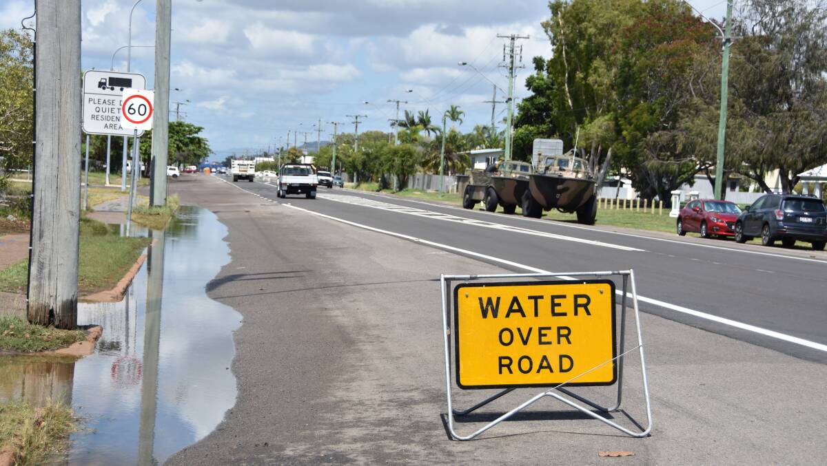 Salt water creeps on to Boundary Street in South Townsville after a king tide peaked at 4.11m this morning.
