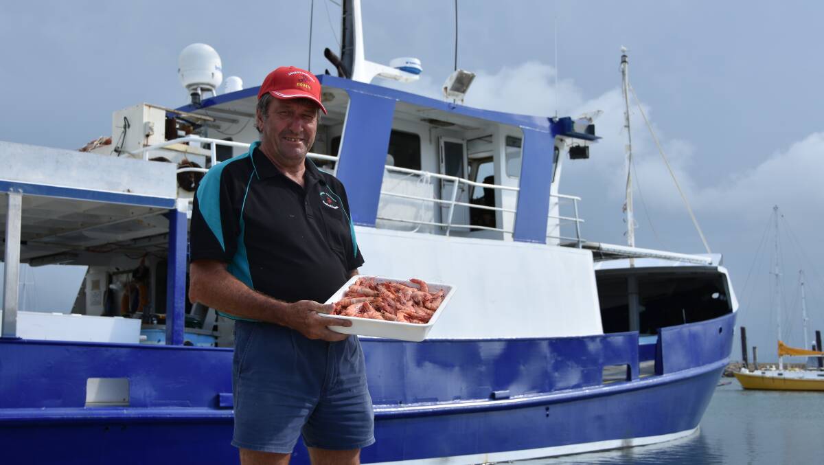 Arabon Seafoods director Terry Must encouraged Queenslanders to buy local seafood this Christmas after a challenging year for fishos in North Queensland.