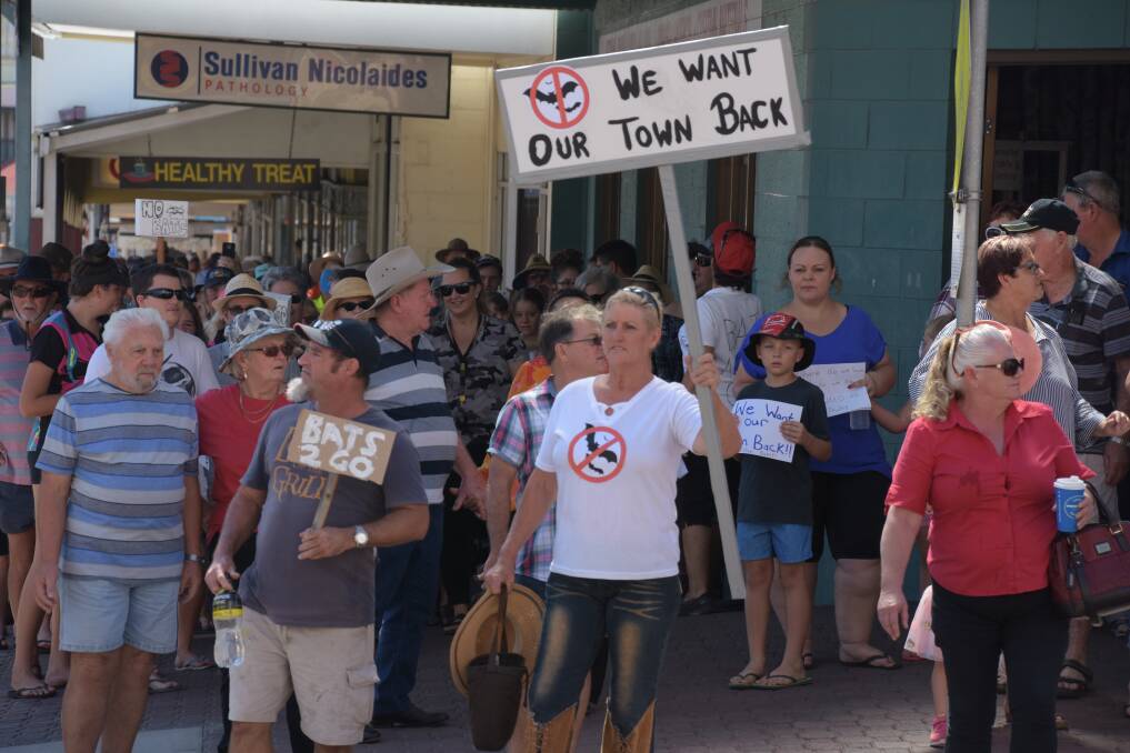 Charters Towers residents march to reclaim their town from a population of up to 200,000 bats that have invaded the CBD.