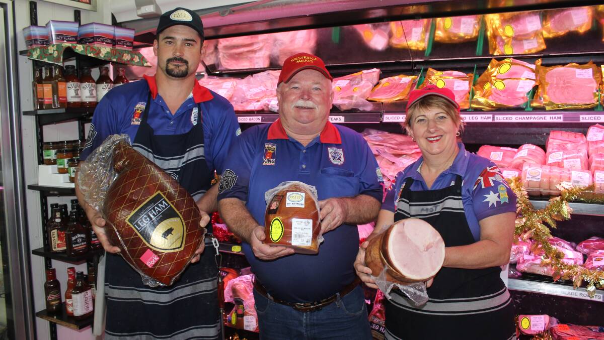 AWARD WINNERS: Westridge Meats' smallgoods maker Kerry Brisbane with owners John and Lyn Yeo. Photo - Helen Walker.