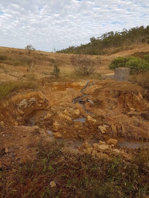 Deep channels have been cut below the dam wall by water gushing from a siphon polypipe in the 1000ML dam flowing straight into the East Normanby River. The EHP intends to bulldoze this massive earth wall.