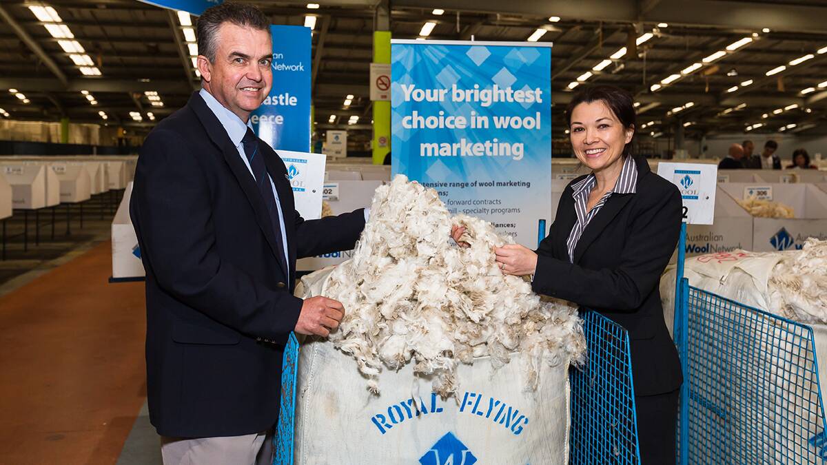AWN NSW state manager Mark Hedley with RFDS representative Allison Reid with the RFDS auction bales in Sydney.