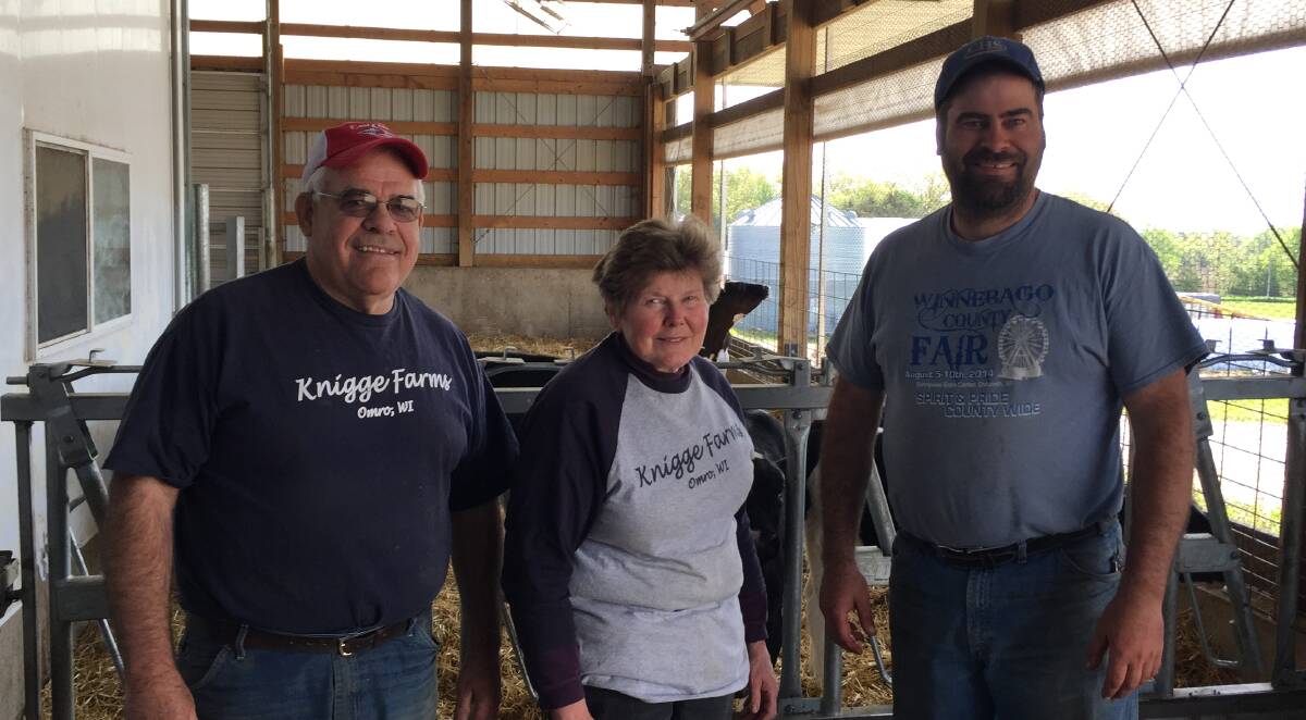 FAMILY FARM: Wisconsin dairy farmers Pete and Theo Knigge and their son Charlie pioneered the use of robotics in the US dairy industry.