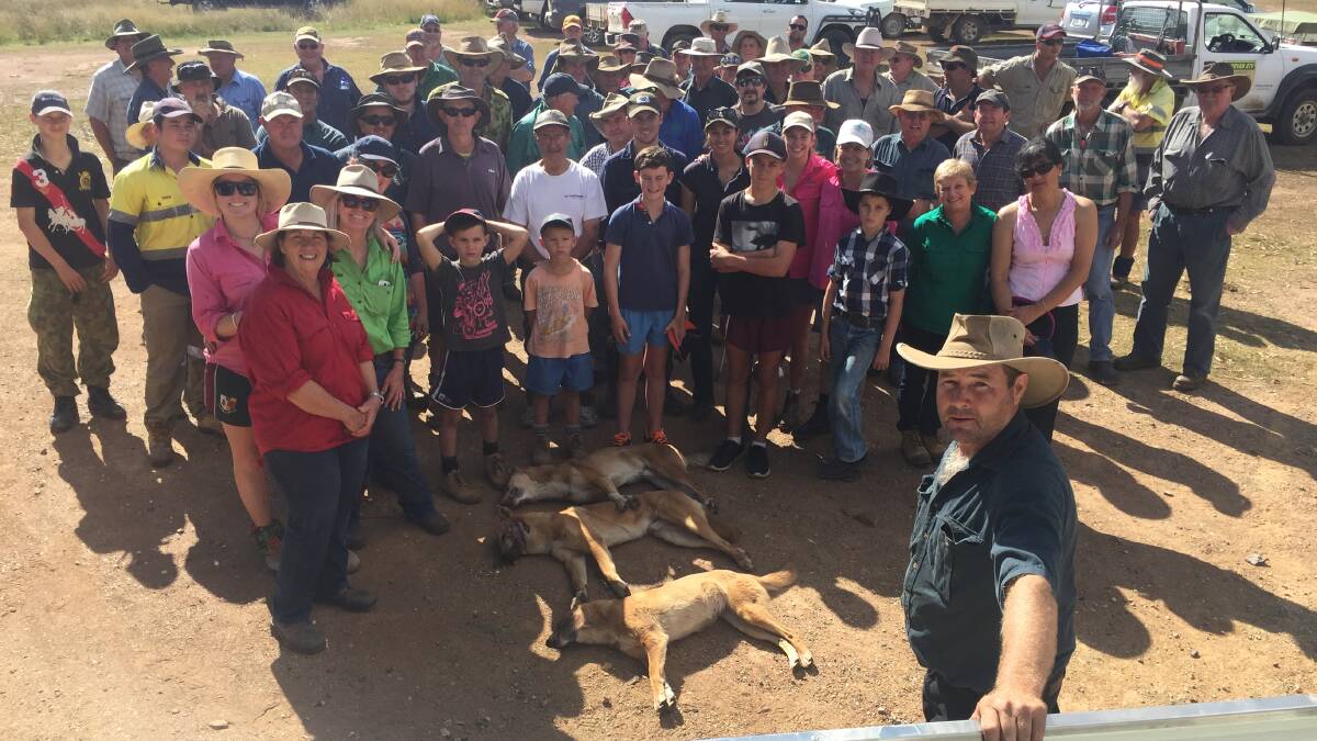COMMUNITY SPIRIT: Karara grazier Ian Cullen with some of 70 people who turned out to help to destroy sheep-killing feral dogs on his property Rockdale.