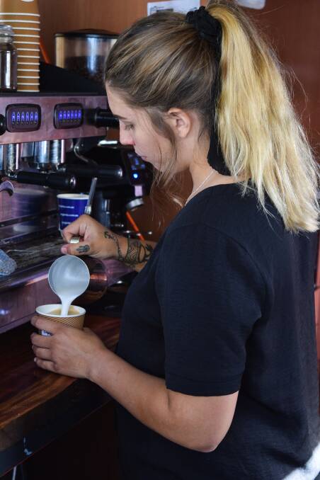 Cuppas on the Cape employee Bethany Surman making some beautiful coffee art. 