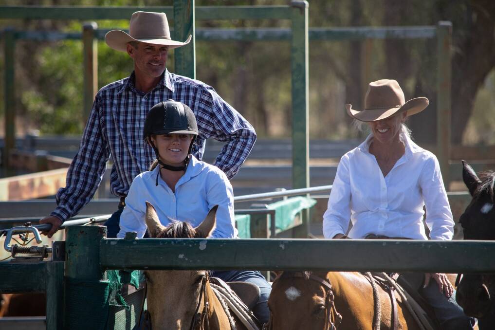 Emily with her father Stewart, and auntie Lisa at Clarke Creek Campdraft. 