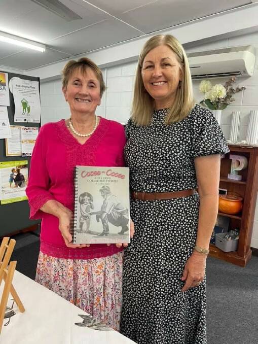 Author Colleen Taylor presenting Cooee-Cooee Colleens Collected Stories to director of Dimbulah Community Center, Grace Armenti.