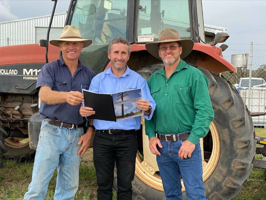 Wide Bay region sugarcane growers Jeffery Plath (left) and Peter McLennan (right) at the launch of the new Canegrowers WHS guide for sugarcane farms with Canegrowers CEO Dan Galligan (centre). Photo: Supplied.