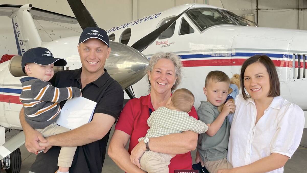 REUNION: Hugh and Lucy Westcott are reunited with Timna Wright (centre), the nurse who helped deliver their son onboard an airplane four years ago. Photo: RFDS.