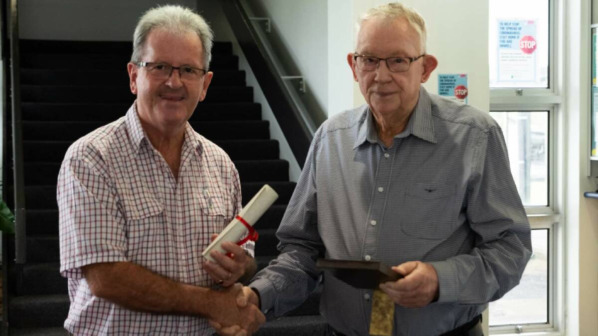 Cassowary Coast Mayor Mark Nolan congratulates Robert Mackay. Pictures: Nicola Tams