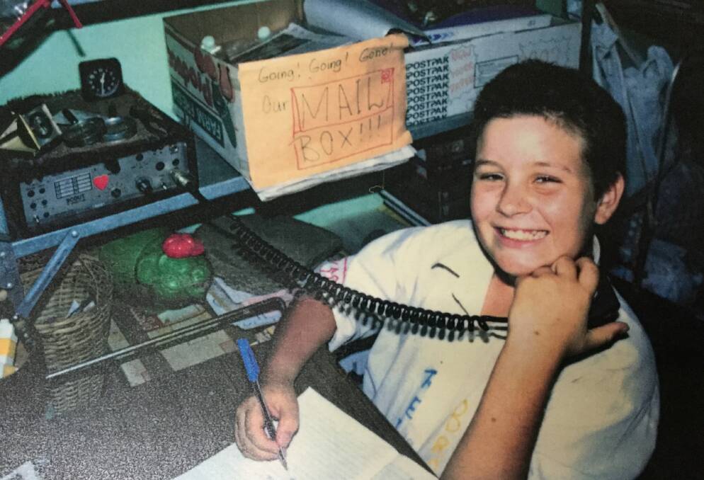 A former CSDE student taking class over the HF radio. Photo: Cairns School of Distance Education.