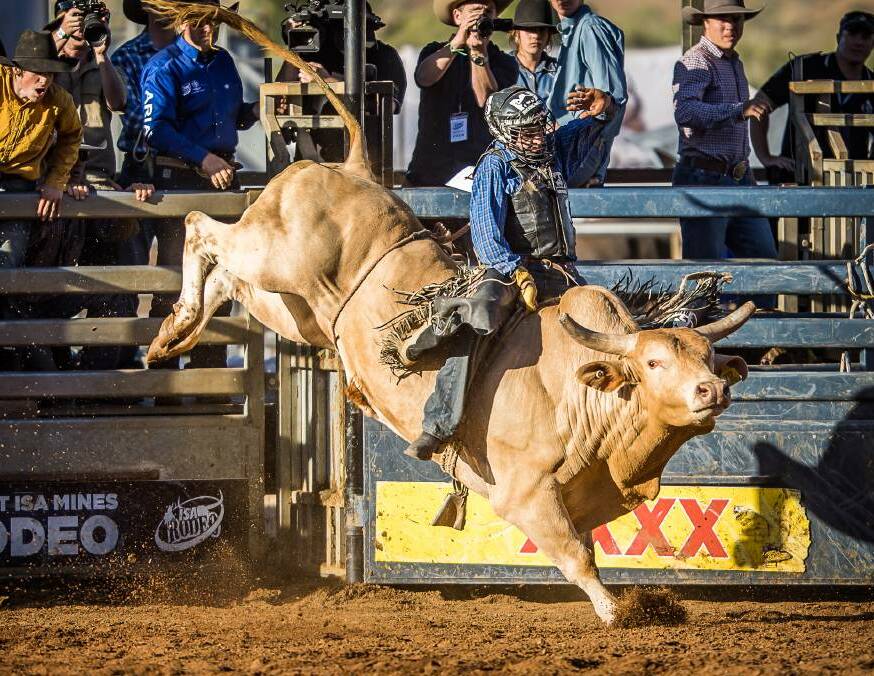 Barcaldine cowboy Jackson Gray marks the highpoint ride of 85pts on board 'Hellraiser'. Rodeo events kick off at 2pm on Sunday, May 7. Picture Stephen Mowbray.