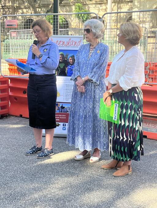 ICPA Queensland president Louise Martin speaking outside Queensland Parliament alongside ICPA Patron Patricia Mitchell and Amanda Walker. Picture: supplied by ICPA Queensland.