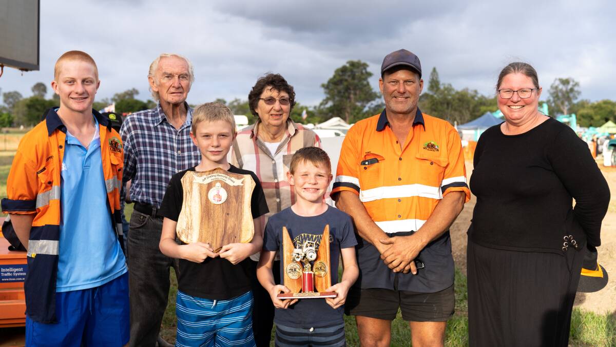 This year's tractor pull honoured club member, the late Jeff Snelling, who died earlier this year with a People's Choice Award. Tony Atherton's Fordson Major got the nod. He is pictured here with Mr Snelling's family - Flynn Hyde (nephew), parents Chris and Judy Snelling, sons Henry and Benjamin, and wife Helen. Picture supplied