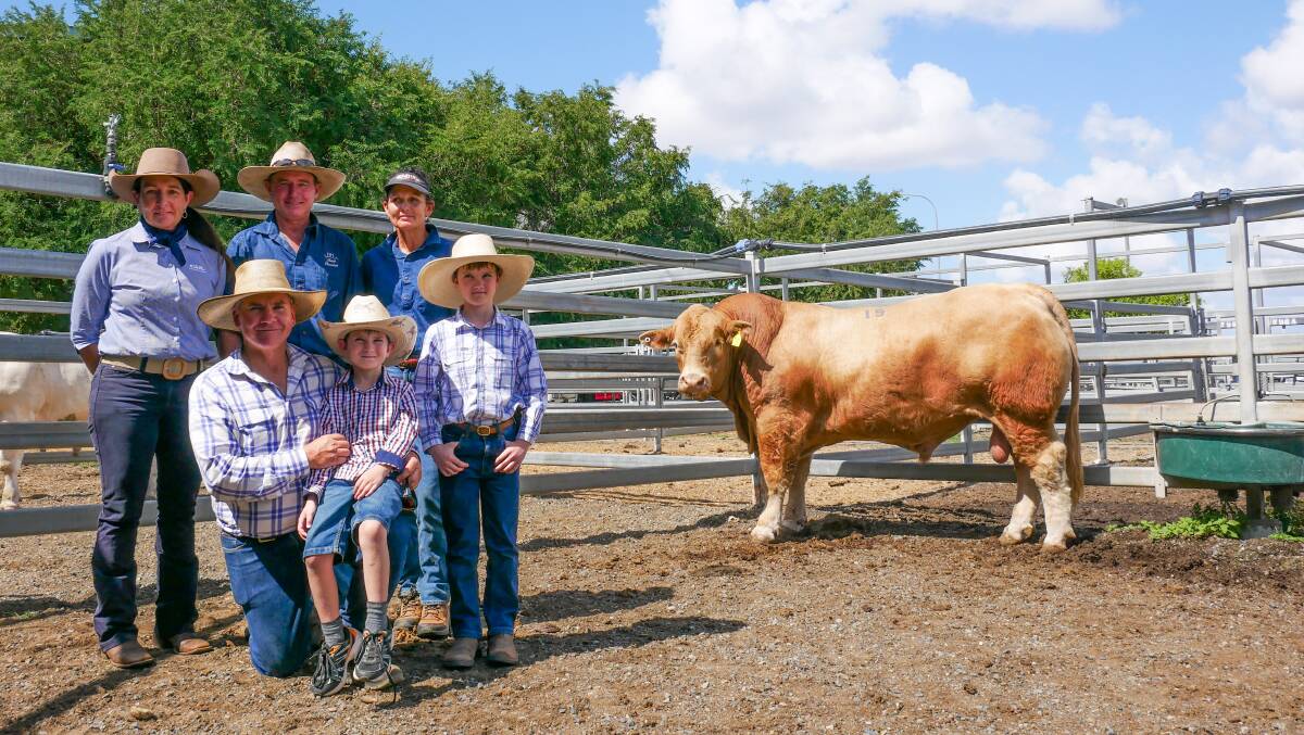 Back row: GDL Rockhampton's Georgie Connor, Vendors David and Helen Reid. Front row: Buyer Stephen Kajewski with sons Rhys and Hayden, with the top price bull, pollled Reids Seamus S50E. Picture by Ellouise Bailey 