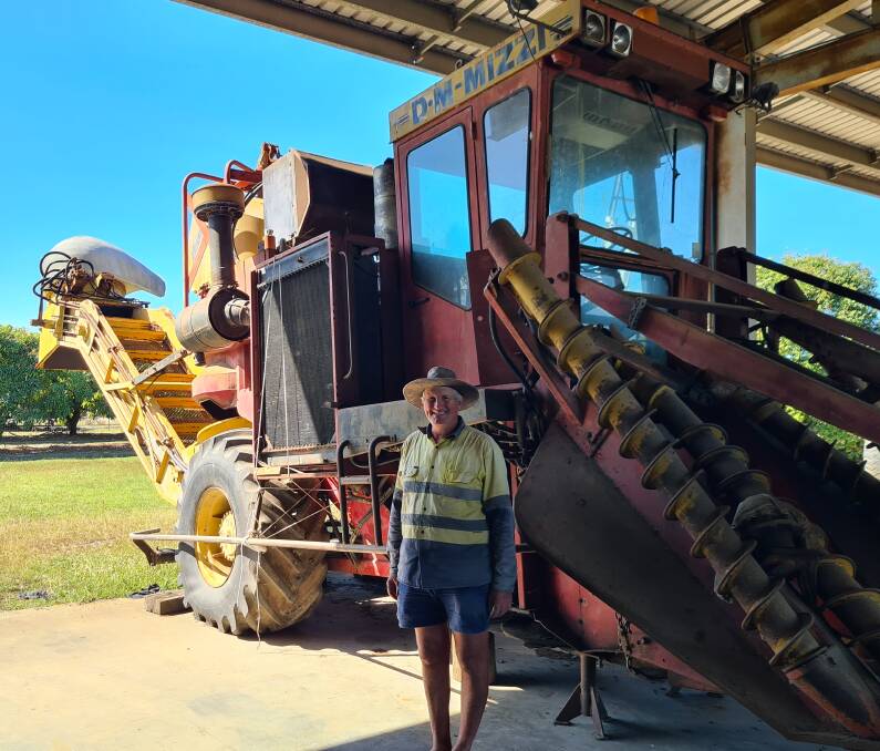 Giru cane farmer Robert Poletto with the prototype of the Mizzi cane harvester. Picture supplied by Peter Towers